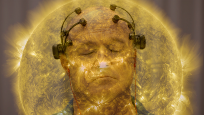man in headphones against the sun