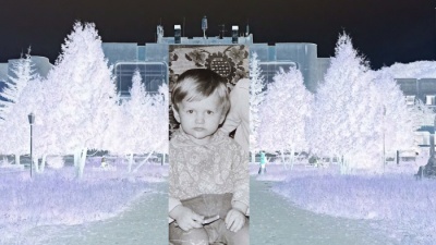 a little boy against the background of the negative image of the park