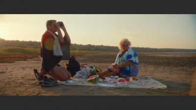 Mother with adult son on the beach among healing mud.