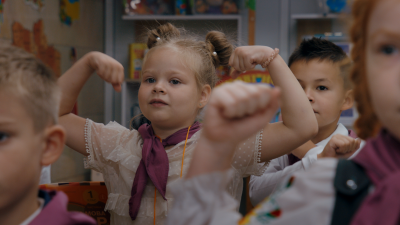 A girl in a school classroom.